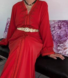 Premium quality handmade silk crepe red Moroccan kaftan. The black belt is included. Important Note: Stainless steel gold belts are not included. Please contact us for more information. This caftan is ideal for family occasions such as family celebrations, the month of Ramadan, Eid, or weddings. Several sizes available. It is also possible to personalize your caftan according to your taste, contact us for more information. Top quality kaftan, handy made. The black belt is included This caftan is ideal for family occasions such as family celebrations, the month of Ramadan, aid, or weddings. Several sizes available, it is possible to have it in Matchi-Matchi version: mom/daughter. It is also possible to customize your caftan according to your taste, contact us for more information Elegant Red Long Sleeve Abaya, Elegant Long Sleeve Red Abaya, Elegant Red Kaftan For Evening, Elegant Festive Kaftan For Traditional Ceremonies, Elegant Red Kaftan, Elegant Red V-neck Kaftan, Elegant Red Abaya For Festive Occasions, Elegant Red Kaftan With Traditional Drape, Elegant Gold Kaftan For Traditional Ceremonies