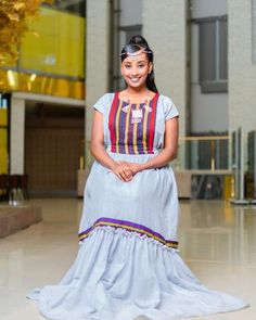 This traditional Shimena Oromo dress is a true beauty, inspired by the intricate designs of Bale culture. Made from high-quality Menen fabric, this dress exudes elegance and sophistication. The full Shimena adds a regal touch, making it perfect for formal occasions. The carefully selected accessories complement the dress's beauty, enhancing its overall elegance. This dress is not only a celebration of Oromo culture but also a tribute to the beauty and richness of traditional Ethiopian fashion. P Oromo Dress, Oromo Culture, 50th Birthday Favors, Ethiopian Fashion, Ethiopian Dress, Habesha Kemis, Birthday Favors, Intricate Designs, True Beauty