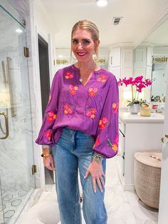 This purple beauty, complete with vibrant floral embroidery and playful balloon sleeves, brings all the charm you need for a day full of plans. Whether you're teaching in the classroom or heading to happy hour with friends, this top easily transitions from professional to fun. Style it with tailored pants for work, then swap for your favorite jeans and bold earrings for a laid-back evening vibe. PRODUCT FIT - TRUE TO SIZE MODEL DETAILS - BRENNA IS WEARING A SIZE SMALL, 5'3" CAROLINE IS WEARING A Casual Purple Blouse With Floral Embroidery, Purple Floral Embroidered Top For Fall, Purple Floral Embroidery Top For Fall, Purple Relaxed Fit Blouse For Spring, Spring Purple Blouse With Relaxed Fit, Purple Blouse With Relaxed Fit For Spring, Spring Purple Embroidered Blouse, Spring Embroidered Purple Blouse, Purple Floral Embroidery Top For Spring