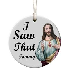 a round ornament with the words i saw that tommy on it and jesus holding a heart