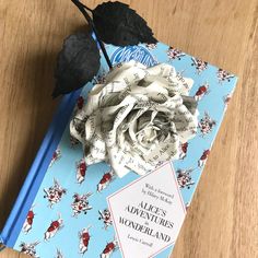 a book with a flower on top of it