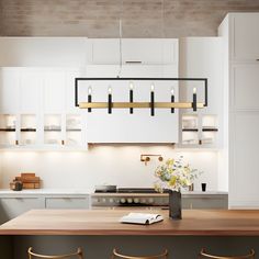 a kitchen with white cabinets and wooden counter tops, along with bar stools in front of the island