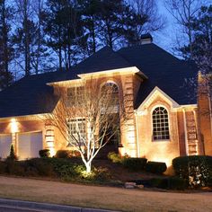 a house is lit up with christmas lights