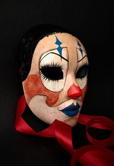 a close up of a mask on a black background