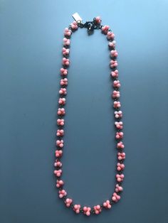 "This necklace was handmade using pink coral peanut beads, approx 6, 8, 9 and 10mm and antique brass eye pins. It measures approximately 27 cm / 10.6 inches in length, and approximately 16 cm / 6.3 inches diameter. Please check your neck measurements before buying, the necklace could be extended  if needed. The necklace is secured with an antique brass lobster clasp. I only use antique brass findings, nickel free. I love the vintage feel they give to my jewellery. This piece is finished with a personalised brass oval charm and a smoked quartz faceted bead. My jewellery is packed carefully inside jewellery boxes with my name on it.  Some photos are close ups, therefore showing the items a lot bigger than in reality, so that you can check the detail. Colors can differ due to the use of flash Handmade Coral Beads, Coral Necklace With Single Strand Round Beads, Coral Single Strand Necklace With Round Beads, Coral Beaded Necklaces With Large Beads, Vintage Coral Necklaces With Large Beads, Coral Necklaces With Colorful Beads For Jewelry Making, Vintage Coral Beaded Necklaces In Red Coral, Vintage Coral Beaded Necklaces, Coral Necklaces With Faceted Round Beads