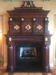 an ornate fireplace in the middle of a room