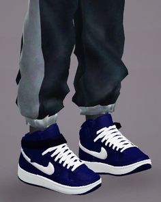 a pair of blue sneakers with white laces on the bottom, and black pants