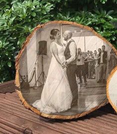 two wooden slices with an image of a bride and groom on them