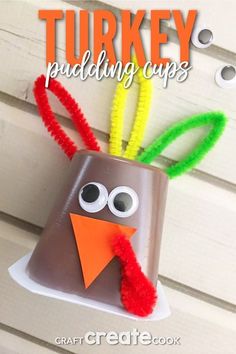 the turkey puddinging cups craft is made out of construction paper and pipe cleaners