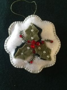 an ornament made out of felt and beads