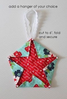 an origami star hanging from a string on top of a white surface with text that reads, add a hanger of your choice cut to 6 fold and secure