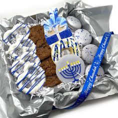 a basket filled with cookies covered in icing and decorated like a menorah