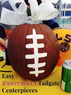 a football pumpkin sitting on top of a table