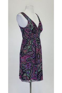 The perfect sun dress for those warm weather days! Its abstract print is fun and playful, while its empire waist silhouette will flatter your shape. Size 2 80% silk, 20% lurex Lining: 100% polyester Side zip closure & hook V-neckline Flowy silhouette Bust 32.5" Waist 28" Shoulder to hem 35" Multicolor Printed V-neck Sundress, Beach Sundress With Paisley Print And V-neck, Patterned Printed V-neck Sundress, Patterned V-neck Printed Sundress, Vibrant Print V-neck Sundress For Summer, Summer V-neck Sundress With Vibrant Print, Summer Sundress With Vibrant Print And V-neck, Patterned V-neck Sundress For Vacation, V-neck Paisley Print Beach Sundress