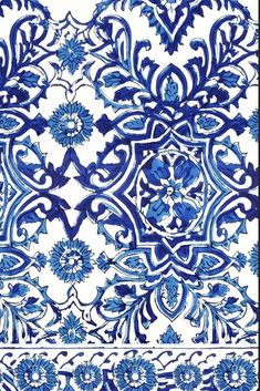 a blue and white tile with an intricate design