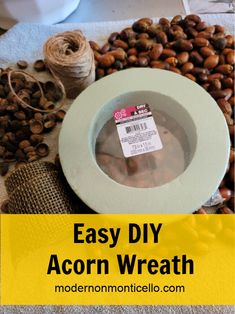 an acorn wreath with the words easy diy acorn wreath on it and some spools of twine