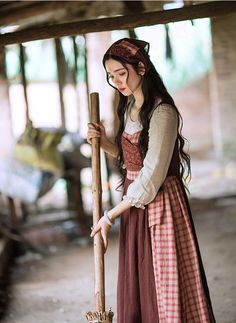 Early 19th century inspired village dress for everyday chores. This faux multi-layered dress features a white blouse part with a scoop neckline and three-quarter blouson sleeves, and a pinafore dress with plaid and ditsy floral patchwork layers. We've deliberately designed the floral patchwork to slant towards one side and attached it with an adjustable lace-up. There's a little pocket dangling at the waist to keep your phone or other knick-knacks. Full knit plaid skirt and partial linen brown s Village Dress, Brown Skirts, Pinafore Dress, White Blouse, Plaid Skirts, Overall Dress, Sweater Blouse, Cardigan Jacket, Head Scarf