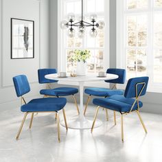 a white table with four blue chairs around it