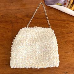 1960s Mr. Ernest Simon white sequin and bead evening handbag with white satin interior, gold hardware and an elegant chain top handle in excellent condition. 6" by 6" with a 5" drop chain. Very nice vintage condition. Great Gift! Chain Top, Evening Handbag, White Satin, Clutch Handbag, Gold Hardware, Evening Bags, Purses And Handbags, Top Handle, 1960s