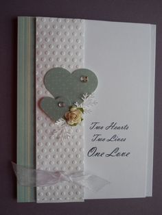 a card with a heart and flowers on it