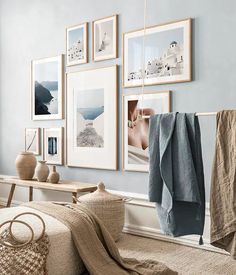 a living room with blue walls and pictures hanging on the wall, including a blanket