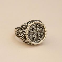 Jerusalem Ring 925 Sterling Silver Handmade Ring The details of Jerusalem Cross were made in order to make it look like carved inside a wood. There's Holy Trinity symbol at the bottom of the sides and a shining Cross above. In the middle sides of the ring, Templar Cross was engraved. The design is open for your customization as you would like... We ship our products with UPS express (within 3-5 days delivery) The production time is 2-3 business days. All sizes are available, please just tell me Carved Sterling Silver Signet Ring, Antique Carved Sterling Silver Signet Ring, Artisan Engraved Signet Ring For Anniversary, Symbolic Carved Sterling Silver Signet Ring, Artisan Silver Rings With Carved Details, Artisan Carved Silver Rings, Artisan Engraved Sterling Silver Signet Ring, Antique Carved Silver Signet Ring, Heirloom Carved Sterling Silver Engraved Ring