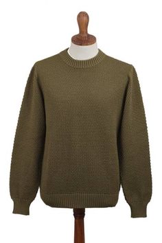 Designed by Peru's Zoila Olaechea this gorgeous men's sweater is made from pima cotton in a solid olive green tone and features a crew neck. With a fit that is great for casual styling this sweater will become your go-to item. You will love the natural texture and color. Olive Crew Neck Sweater For Fall, Classic Green Textured Knit Sweater, Green Tone, Green Tones, Retro Tshirt, Cotton Sweater, Natural Texture, Men's Sweater, Pima Cotton