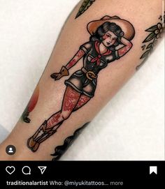 a woman with a cowboy hat and boots on her leg is shown in this tattoo