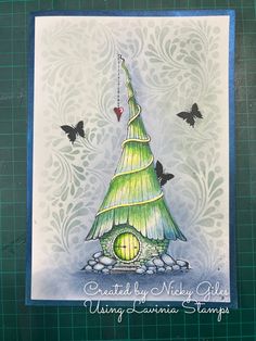 a green christmas tree card with butterflies around it and the words, create by nishy giraffes using donna stamps