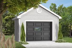 the garage is painted gray and has a white trim around the door, along with two windows