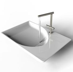 a white sink with a metal faucet on it