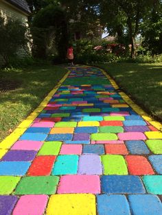 Colorful Playground Ideas, Rainbow Garden Ideas, Yellow Brick Road Floor Decal, Diy Yellow Brick Road, Wizard Of Oz Yellow Brick Road Diy, Yellow Brick Road Wizard Of Oz, Rainbow Road, Outdoor Restaurant Design, Rock Garden Design