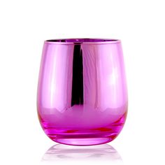 a purple glass sitting on top of a white table