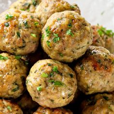 a pile of meatballs with parsley on top