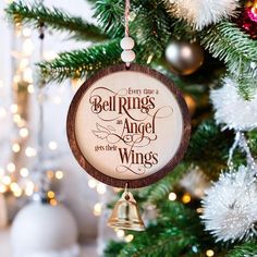 a wooden ornament hanging from a christmas tree that says, every thing is an angel