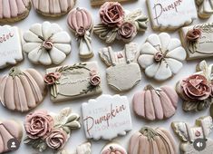 many decorated cookies are displayed on a table