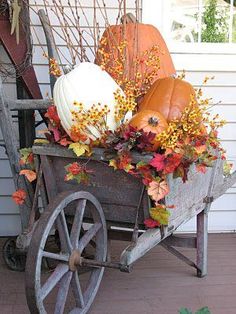 a wagon filled with pumpkins and gourds