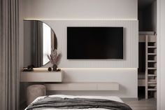 a bedroom with a tv mounted on the wall and a bed in front of it