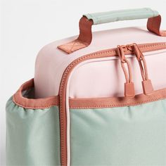 A fun and functional lunch box that's built to handle all the thrills and spills of the day. Combining colorblocks of candyfloss pink and mint green with pops of coral trim, our bag is constructed of food-safe and supremely durable polyester made from recycled water bottles. It's also lightweight and easy to clean, plus roomy enough to hold multiple storage containers. An insulated lining keeps meals just the way your kid likes them-hot, cold or somewhere in between. An outer pocket safely stows Cute Pink Lunch Bag For Playtime, Pink Rectangular Lunch Bag For Outdoor Activities, Rectangular Pink Lunch Bag For Outdoor Activities, Playful Pink Lunch Box For Playtime, Pink Functional Lunch Bag For Outdoor Activities, Functional Pink Lunch Bag For Outdoor Activities, Pink Rectangular Lunch Bag For Daycare, Playful Pink Lunch Bag For Back To School, Playful Pink Rectangular Lunch Bag