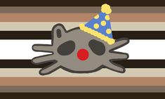 a cat with a party hat on top of it's head is laying down