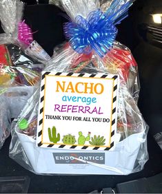 the back of a car filled with candy and wrapped in plastic bags that says nacho average refer thank you for all you do