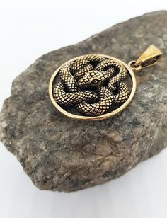 This item is made to order. Casting in any metal will take 14-19 days. Please, leave your orders.Astonishing snake pendant, unisex. Bronze or silver, with or without leather cord.Size - 1 inches / 2,6 cmWeight for bronze -  5,8 g.Weight for silver -  7,1 g.✤ If you have any questions - feel free to ask! Spiritual Metal Jewelry In Snake Shape, Spiritual Snake-shaped Metal Jewelry, Engraved Metal Snake-shaped Jewelry, Bronze Snake-shaped Jewelry Gift, Bronze Snake-shaped Jewelry For Gift, Bronze Snake Shape Jewelry As Gift, Nickel-free Snake-shaped Jewelry Gift, Spiritual Brass Snake-shaped Jewelry, Spiritual Brass Jewelry In Snake Shape