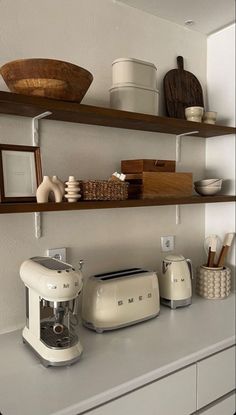 the kitchen counter is clean and ready to be used as a coffee maker, toaster, blender and other items