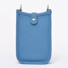 The crossbody phone bag is crafted from genuine cowhide top grain leather (togo), setting a high standard for style and durability. Perfect for those who appreciate the elegance of simplicity, this bag boasts an easy-access design with 3 card slots at the back. The open interior, secured by a top button closure, provides a safe and convenient space for your essentials. The strap, made from the same superior leather, is adjustable to suit your comfort and style.The bag is available in five captiv Everyday Solid Color Crossbody Phone Bag, Solid Color Leather Rectangular Phone Bag, Crossbody Phone Bag For Everyday Use, Chic Solid Phone Bag For Travel, Chic Solid Phone Bag For Everyday Use, Classic Crossbody Phone Bag For Daily Use, Soft Leather Phone Bag For On-the-go, Soft Leather Phone Bag Pouch For On-the-go, Classic Crossbody Phone Bag With Cell Phone Pocket