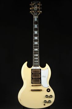 an electric guitar is shown against a black background