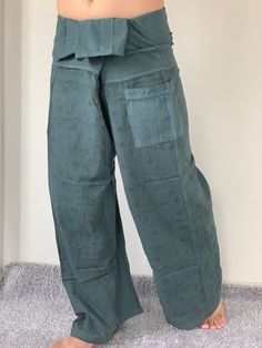 "Unisex Thai fisherman pants. One size fits all. You can wear in many occasions, casual wear, yoga wear, relax at home, travel etc. If you are looking for some pants that you can wear everywhere, comfortable, relax and Easy to wear. Thai fisherman pants is Answer!! Nice gift for yourself or your lover One pocket on the side for storing your items such as wallets, mobile phones, etc Approx. Measurements: One size can fits most and 1 Pockets Waist around 51\" (Wrap Pants) Length 45\" Lower Leg 14\ Ninja Pants, Yoga Harem Pants, Cotton Ball Lights, Samurai Pants, Thai Fisherman Pants, Handmade Pants, Fisherman Pants, Wrap Pants, Unisex Pants