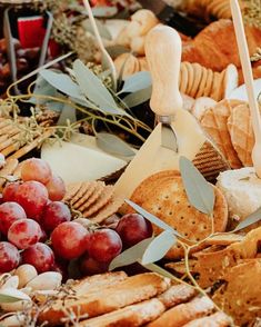 an assortment of breads, crackers and grapes