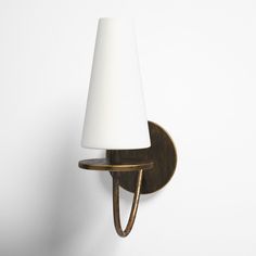 a wall light with a white shade on it