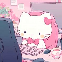 a hello kitty sitting in front of a computer