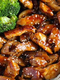 chicken and broccoli on a plate with sesame seeds